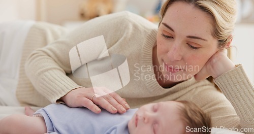 Image of Family, love and a woman on the bed with her baby for sleep, rest or bonding together in a home. Children, bedroom and a mother in an apartment with her newborn infant to relax for care or growth