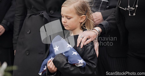 Image of Funeral, cemetery and girl with American flag for veteran for respect, ceremony and memorial service. Family, depression and sad child by coffin in graveyard mourning military, army and soldier hero