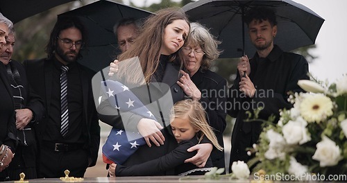 Image of Funeral, family hug and sad people with grief support, goodbye service and mourning death at burial event. Kid child, mom embrace and group gathering together at coffin, casket and crying at ceremony