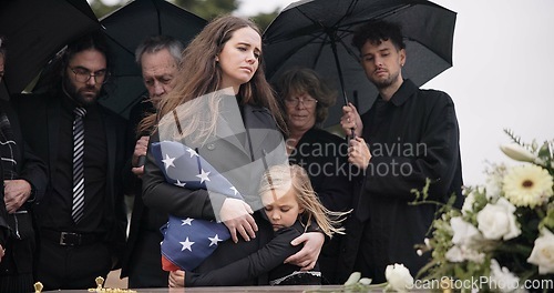 Image of Funeral, family and sad people with American flag, grief and mourning death, burial and widow depressed at farewell event. Kid, mother and group gathering at coffin, casket and crying at ceremony