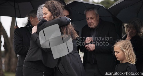 Image of Funeral, crying family and people hug for grief support, mourning depression and death at emotional burial event. Kid child, mom and group together with widow hugging senior mother at coffin ceremony