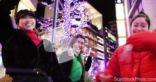 Image of Japanese women at night, dancing in city and fun with energy, happiness and celebration outdoor. Freedom, dancer group and smile on urban street in Tokyo, friends together and gen z with nightlife