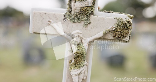 Image of Funeral, tombstone or Jesus Christ on cross in cemetery for death ceremony, religion or memorial service. Symbol, background or Christian sign on gravestone for burial or loss in public graveyard