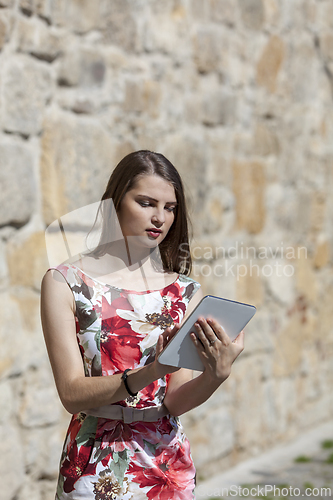 Image of Young Woman Using a Tablet