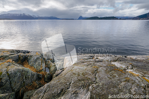 Image of Serene seaside scene captured at dusk in a scandinavian fjord