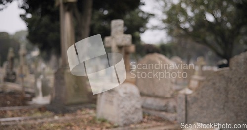 Image of Funeral, empty graveyard and tombstones for death ceremony, religion or memorial service. Catholic symbol, background or Christian sign on gravestone for mourning, burial or loss in public cemetery