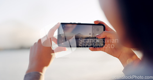 Image of Hands, phone and photography by lake, mountain and nature with landscape, horizon and outdoor adventure. Person, smartphone screen and camera for Mt Fuji, memory and post on social media in Japan