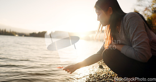 Image of Japanese woman, red maple leaf and Lake Kawaguchi with game, thinking or memory in nature, adventure or holiday. Girl, plant and sunrise for vacation by forest, environment or waves by water in Tokyo
