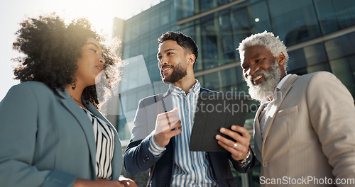 Image of Business people, outdoor and walking with conversation, tablet and New York city with professionals. Corporate, urban town and group with ideas, technology and summer with social media and connection