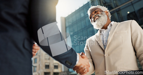 Image of Outdoor, business people and men with handshake, greeting and contract with lens flare, corporate and smile. Staff, employees in a city and coworkers with hello, partnership and about us with friends