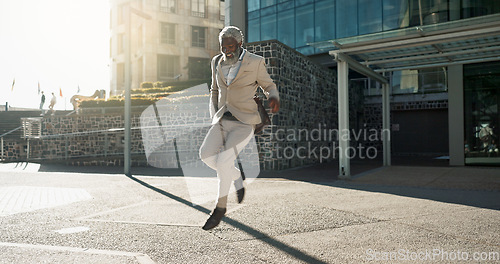 Image of Senior business man, dancing and street for celebration, goals or happy with career achievement. Elderly African entrepreneur, CEO or dancer with moving, steps or smile for profit at job in Cape Town