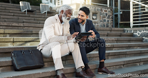Image of Tablet, conversation and business men in the city in discussion for corporate legal case. Teamwork, collaboration and male attorneys with digital technology sitting and talking on stairs in town.