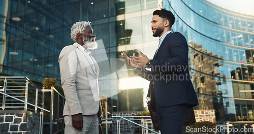 Image of Business men, friends and walk in street, check watch and ready for meeting, schedule or happy in city. Partnership, time management and direction to workplace with discussion, road or metro sidewalk