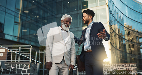 Image of Business men, friends and walk in street, check watch and ready for meeting, schedule or happy in city. Partnership, time management and direction to workplace with discussion, road or metro sidewalk