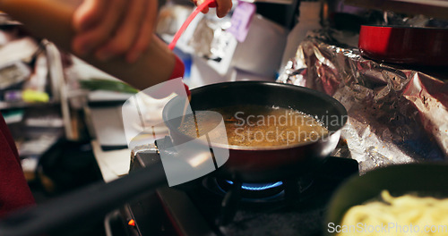 Image of Cooking, sauce and person with pan on gas stove at food market for meal preparation, eating and nutrition. Culinary, restaurant and closeup of utensils to prepare lunch, cuisine dinner and supper