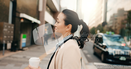 Image of Coffee, walking and Japanese business woman in the city crossing the road to work or job. Cappuccino, travel and professional young female person commuting with caffeine in the morning in urban town.