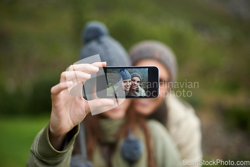 Image of Couple, selfie and photo while hiking in nature, smartphone and capture moment in outdoors. People, happy and picture for memory and exploring wilderness, trekking and photograph for social media