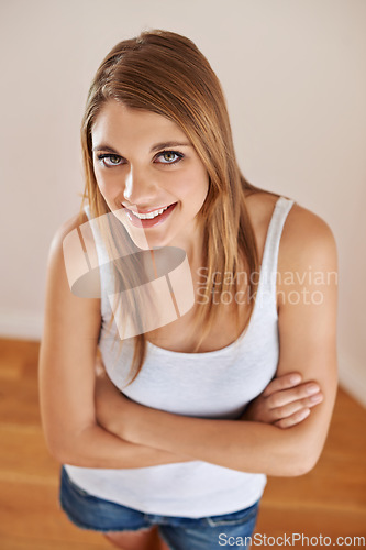 Image of Woman, portrait and beauty confidence with smile for good mood holiday or relax, cosmetics or vacation. Female person, face and healthy with crossed arms from above for wellness, wall or happy