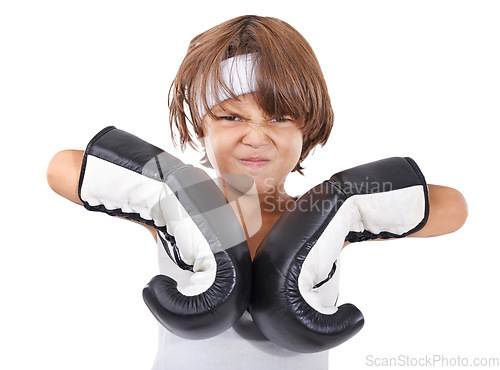 Image of Boxing, gloves and portrait of child in fight with anger and learning martial arts in white background. Challenge, boxer or kid with training in self defense, exercise or practice with gear in studio