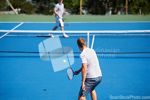 Image of Tennis, game and men with fitness, sports and competition with training and exercise. Players, friends and guys with rackets and court with workout and sunshine with challenge and cardio with a ball