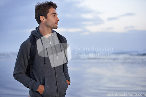 Image of Thinking, beach and man with holiday, travel and backpack with vacation, summer break or getaway trip. Person, seaside or traveller with nature or wellness with water, explore or adventure or journey