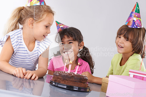 Image of Friends, children and birthday cake, party and candles with happy people for celebration, youth and dessert. Special day, together in festive mood and kids smile for social event with chocolate