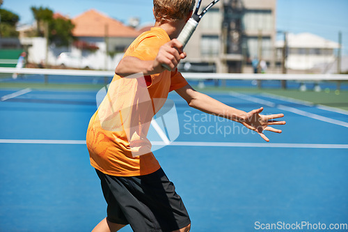 Image of Back, tennis and person with racket, game and fitness with energy and training with competition. Player, sunshine and athlete with equipment and workout with challenge, sports and exercise on court