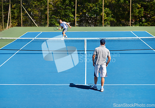 Image of Tennis, back and men with fitness, match and competition with training and exercise. Players, friends or sports with rackets and court with workout and sunshine with challenge and cardio with a ball