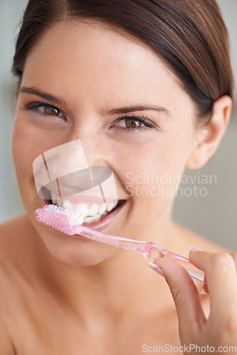 Image of Toothbrush, happy and portrait of woman in bathroom for dental care, oral hygiene and cleaning. Healthcare, whitening and face of person brushing teeth with toothpaste for wellness and healthy mouth