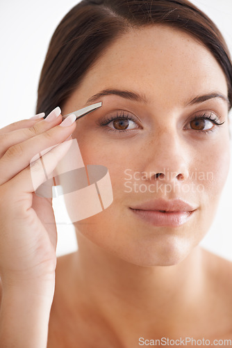 Image of Plucking, eyebrow and portrait of woman with beauty, tweezers and self care in bathroom. Makeup, routine and girl with hair removal, tools and facial grooming or cleaning for skincare and cosmetics
