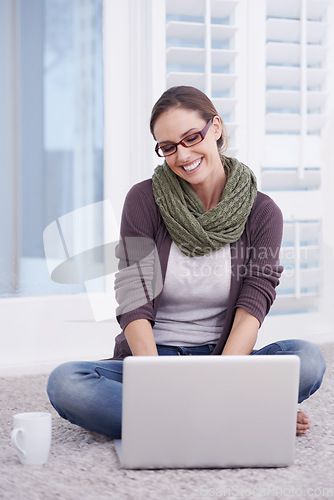 Image of Woman, laptop on living room floor and remote work with research, information and writing email for blog and copywriting. Productivity, coffee and happy working from home, freelancing and copywriter