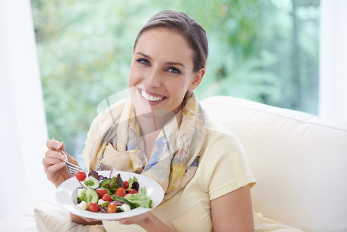 Image of Woman, eating salad and food for diet, vegetables and lunch with happiness in portrait. Nutrition, wellness and healthy vegan meal for cholesterol with smile, detox and snack for dinner at home