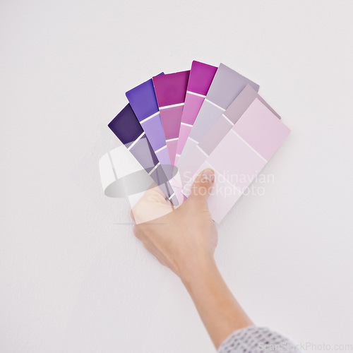 Image of Hand, color swatches for interior design and paint choice, home renovation and person for development and plan. DIY project, painter decision and palette for creativity and decor on white background