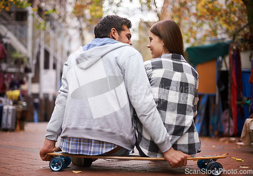 Image of Couple, travel on skateboard and outdoor in city, happy and conversation with partner, learn together and relationship. Cape town, fun and hobby with boyfriend and girlfriend in street, love or date