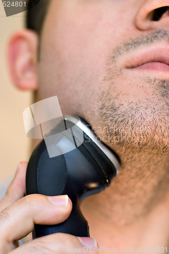 Image of Man Shaving His Goatee