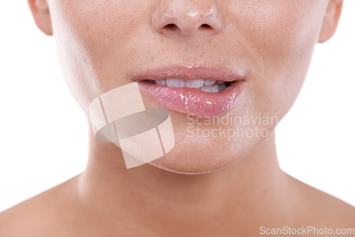 Image of Woman, flirting and biting lips closeup in white background, mock up and studio with beauty. Model, gesture and nervous body language or excited person with teeth on skin of mouth in backdrop