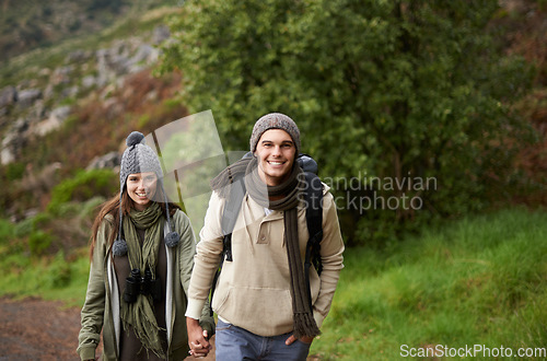 Image of Couple, portrait and hiking on mountain or holding hands with travel, adventure or holiday for experience or fitness. Man, woman or trekking outdoor on trail for cardio, exercise or workout with love