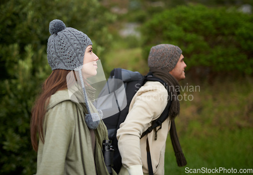 Image of Couple, happy and hiking in forest or nature with travel, adventure or holiday for experience or fitness. Man, woman or trekking outdoor in woods for cardio, exercise or workout with view or backpack