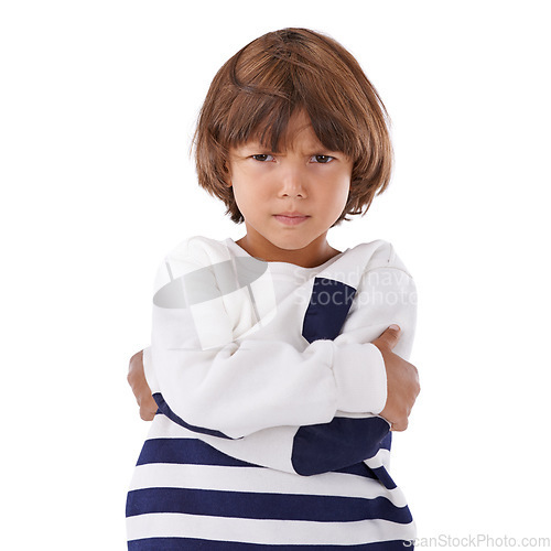 Image of Boy, child and angry in portrait with arms crossed, frustrated and stress, emotion and frown on white background. Youth, upset or disappointed with tantrum, bad attitude with problem in studio