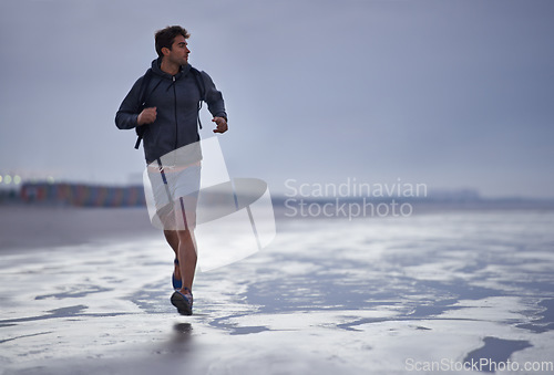 Image of Running, beach and man with vacation, travel and exercise with nature, explore and ocean. Person, runner and guy with fun, water and sunset with wellness and breathing with workout, energy and Miami