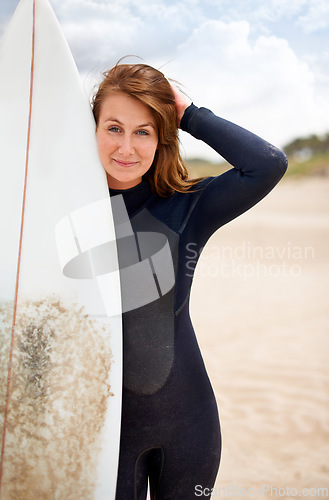 Image of Surfer, woman and portrait on beach with surfboard, vacation and adventure for fitness and travel. Ocean, waves for surfing and seaside holiday in Hawaii, nature and tourism with extreme sports