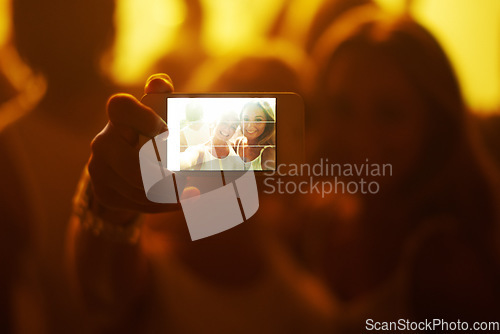 Image of Friends, women and selfie with phone screen, party or happy in portrait, nightclub or web blog. Girl, people and smartphone for photography, memory or profile picture at concert, rave or social media