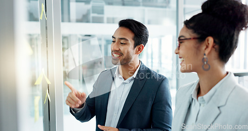 Image of Business man, woman and planning by glass board, point and talk with thinking, notes and problem solving. Corporate partnership, brainstorming and discussion with moodboard, decision and solution