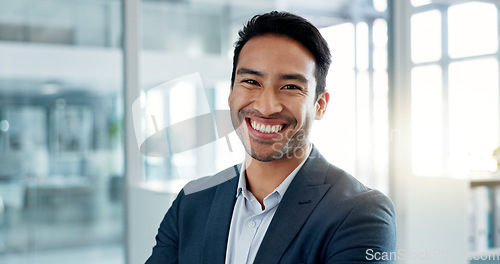 Image of Asian business man, arms crossed and face in office, smile and pride for leadership, management and professional. Financial advisor, businessman and happy in portrait, suit and ambition in workplace