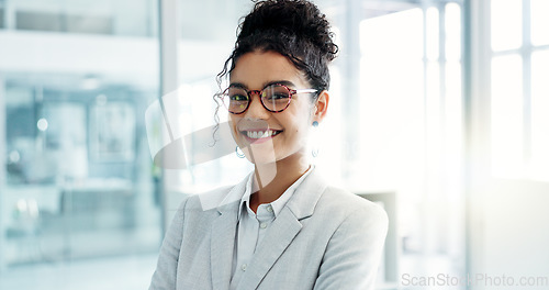 Image of Face, business and woman with a smile, office and arms crossed with a career, consultant and entrepreneur. Portrait, person or employee with glasses, workplace or agent with ambition or administrator