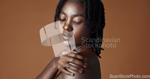 Image of Face, beauty and skincare with happy black woman in studio isolated on brown background for wellness. Portrait, aesthetic and smile for foundation cosmetics or dermatology with a natural young person