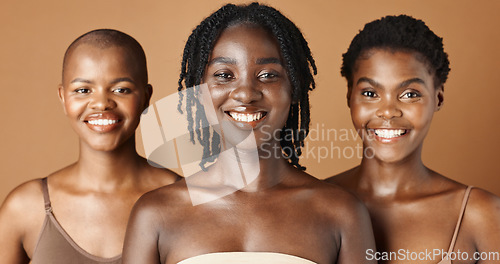 Image of Face, beauty and natural with black woman friends in studio on a brown background for a wellness routine. Portrait, skincare and smile with a group of people looking confident at antiaging treatment