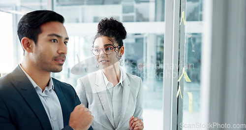 Image of Business people, planning and glass board with point, talk and thinking with notes for problem solving. Partnership, man and woman with brainstorming, reading and moodboard with decision for solution