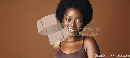 Image of Face of black woman, afro model or natural beauty for wellness, cosmetics or healthy skin in studio. Dermatology, pride or serious African person with glow or skincare results on brown background