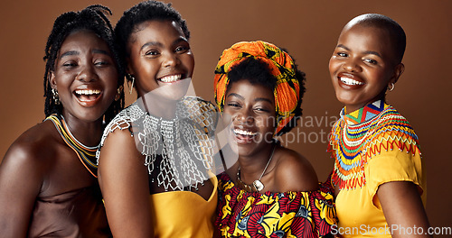 Image of Traditional African women, group and studio for face, jewelry or beads necklace in clothes by brown background. Black people, model and indigenous fashion for friends, culture or portrait for kwanzaa